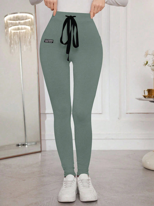 Modelyn Leggings ajustados con cordón y estampado de letras para mujer