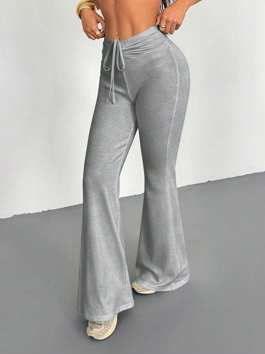SHEIN Pantalones largos cómodos de corte ajustado y acampanados