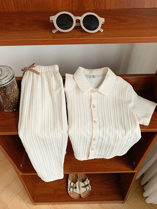 SHEIN Conjunto de camisa  y pantalón con estampado de rayas onduladas para niños