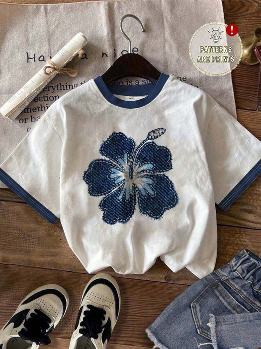 SHEIN EZwear Camiseta de ajuste holgado, estampado floral azul y estilo minimalista
