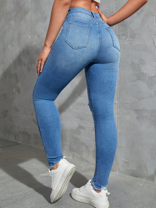 SHEIN EZwear Vaqueros ajustados desgastados de moda sólidos para mujer