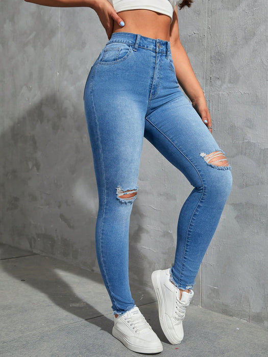 SHEIN EZwear Vaqueros ajustados desgastados de moda sólidos para mujer