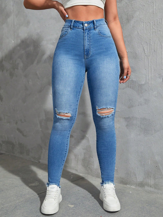 SHEIN EZwear Vaqueros ajustados desgastados de moda sólidos para mujer