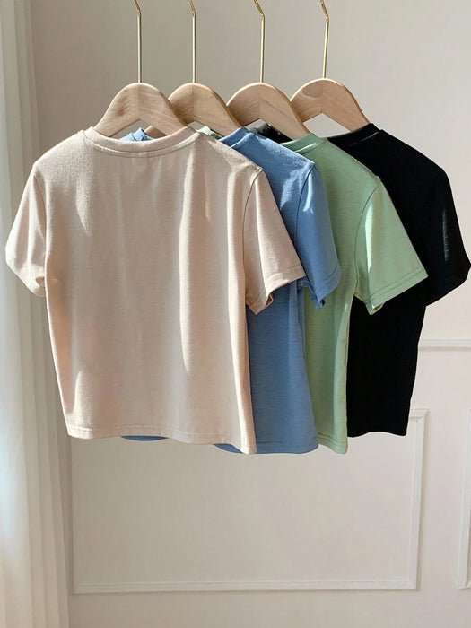 SHEIN 4 camisetas de manga corta con estampado de letras en relieve para niños