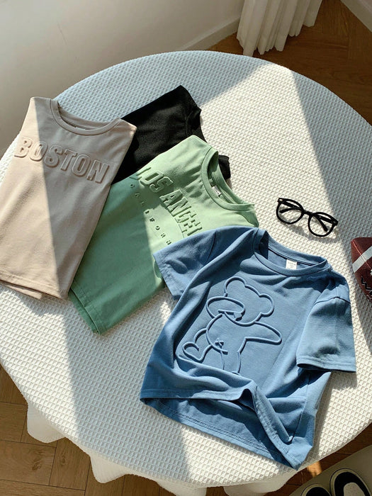 SHEIN 4 camisetas de manga corta con estampado de letras en relieve para niños