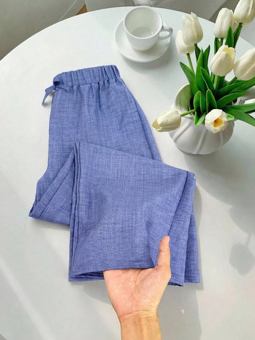 SHEIN Pantalones azules informales texturizados de corte holgado para niñas