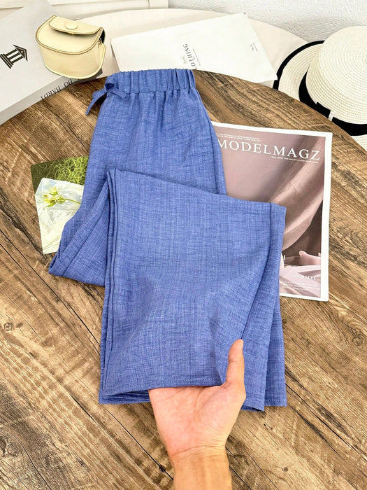 SHEIN Pantalones azules informales texturizados de corte holgado para niñas