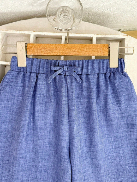 SHEIN Pantalones azules informales texturizados de corte holgado para niñas