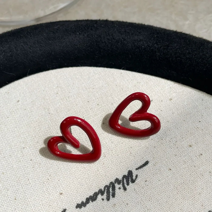 Pendientes Ankela rojos de boton con forma de corazon