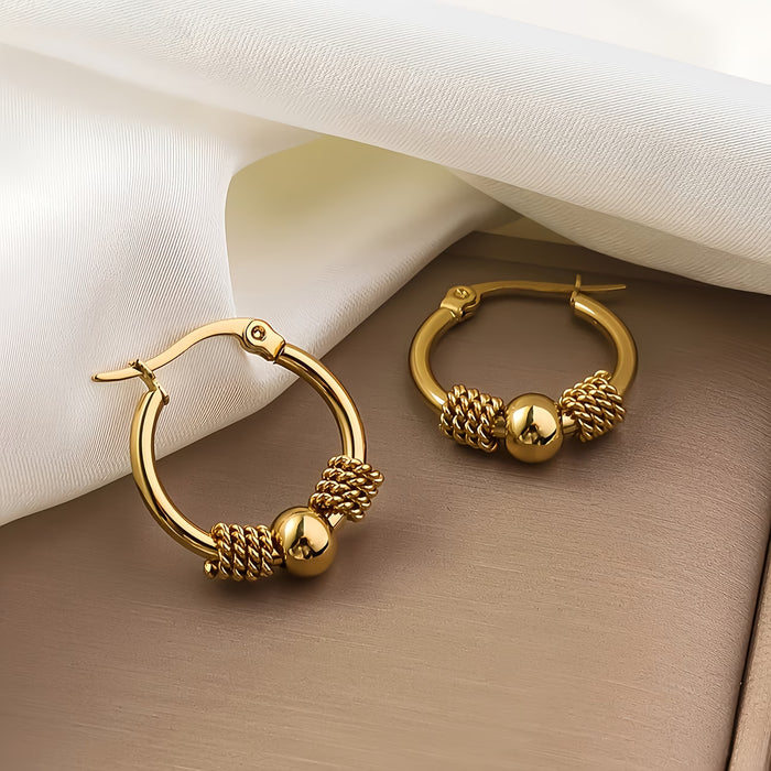 Un par de aretes de acero inoxidable vintage de moda para mujer