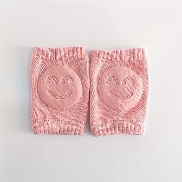Rodilleras infantiles antideslizantes con cara alegre color rosa