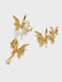 alus de boonee Juego de 3 pendientes de mariposa con textura metálica - Quierox - Tienda Online