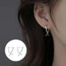 Aretes Plateados Cruzados Estilo Moderno Elegante - Quierox - Tienda Online