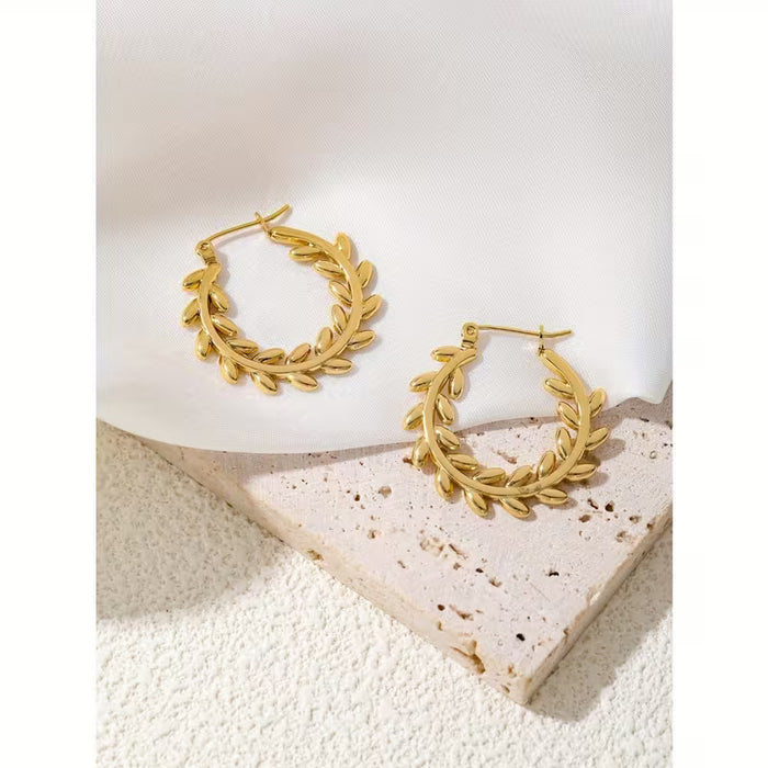 1 Par de Aretes Circulares , Huecos en Acero Inoxidable con diseño Minimalista