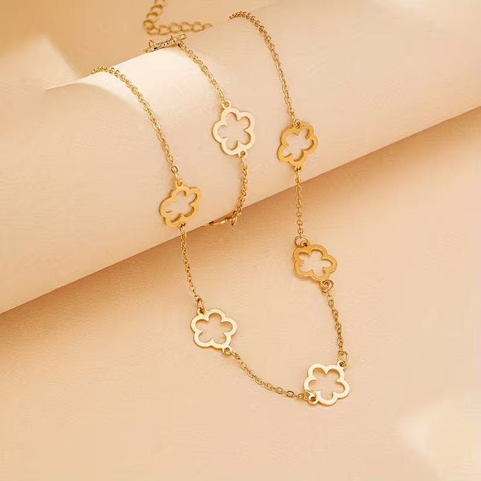 Collar y pulsera de trébol hueco para mujer