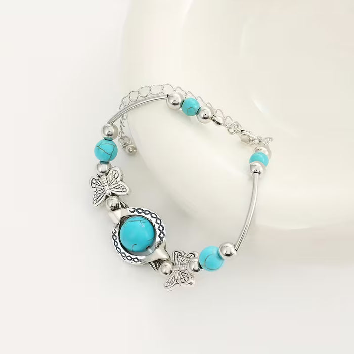 Pulsera turquesa vintage hecha a mano, cuentas de la suerte de mariposa