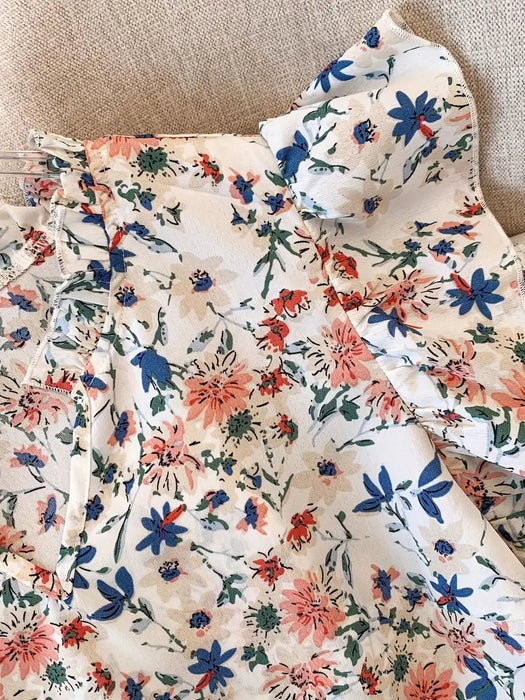 Elegante blusa con cuello en V y estampado floral para mujer. Manga corta, tela no elástica. - Quierox - Tienda Online