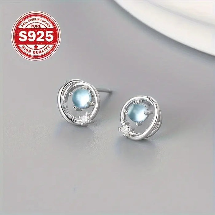 1 par de aretes de botón redondos huecos de color claro de luna