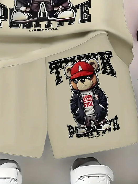 Conjunto de dos piezas para niño de diseño beige con estampado 3D de un oso con gorra