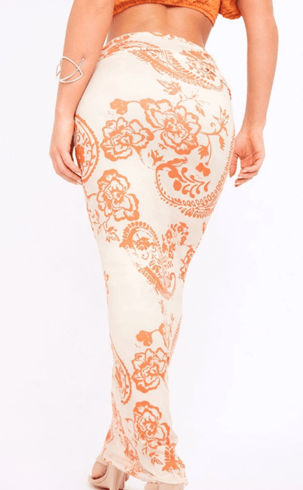 Falda maxi de punto suave con estampado de remolinos naranjas y detalle de costura - Quierox - Tienda Online