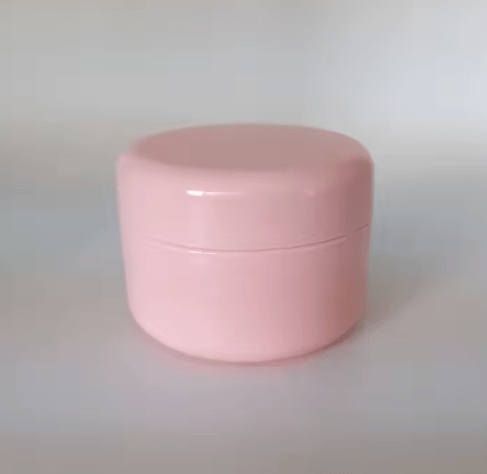 Frasco vacío de plástico rosado con forma redonda para cremas - Quierox - Tienda Online