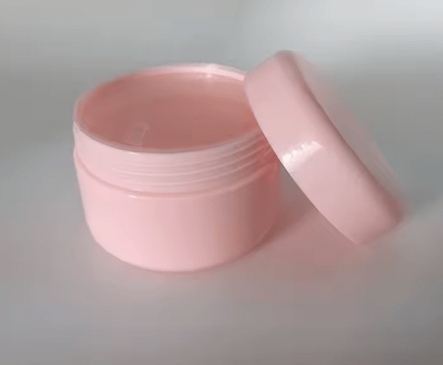 Frasco vacío de plástico rosado con forma redonda para cremas - Quierox - Tienda Online