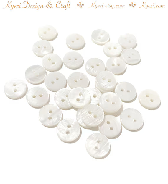 100 botones de concha natural, redondos, de nácar blanco, para costura y manualidades, con 2 agujeros.