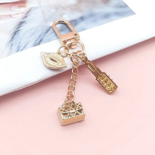Llavero con colgante de labios, bolso y pintalabios - Quierox - Tienda Online
