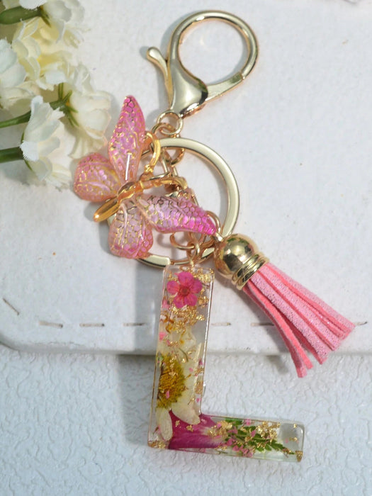 Llavero con inicial para niñas y mujeres, llavero rosa con flor seca de diente de león - Quierox - Tienda Online