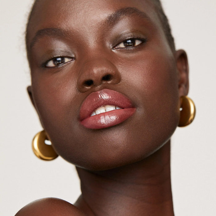 Merit Shade slick Aceite labial con color - Quierox - Tienda Online
