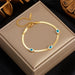 Pulsera de acero inoxidable con dije de ojo azul para mujer, Color dorado - Quierox - Tienda Online