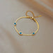 Pulsera de acero inoxidable con dije de ojo azul para mujer, Color dorado - Quierox - Tienda Online