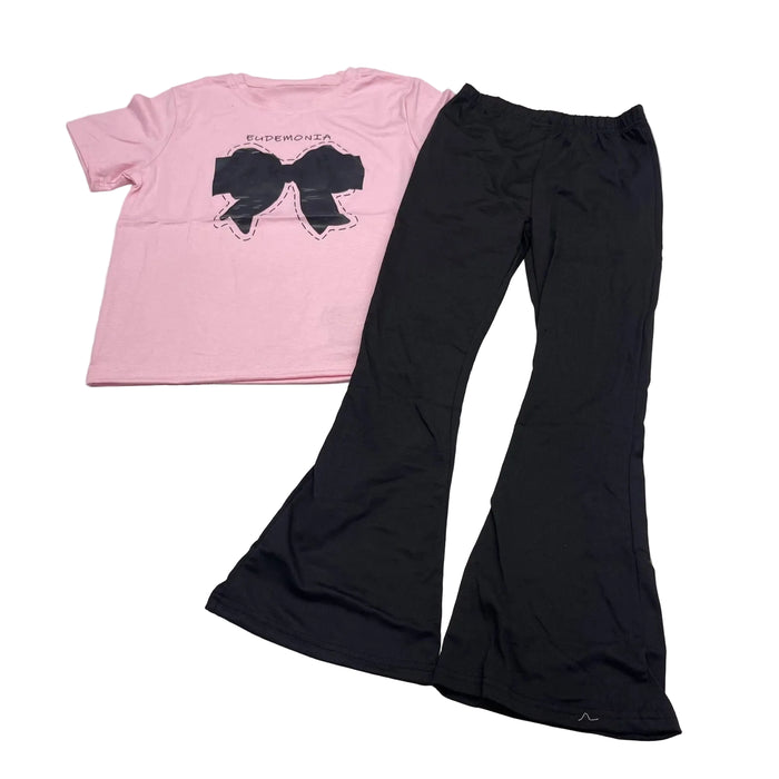 Conjunto de  camisa rosa con lazo y pantalones acampanados negros para niñas