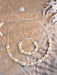 Set de 2 piezas de pulsera y collar con flores de arcilla polimérica y conchas - Quierox - Tienda Online