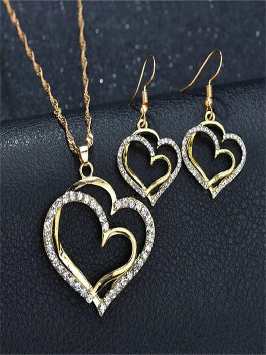 Set de joyería de 2 piezas con colgante y pendientes con forma de corazón hueco - Quierox - Tienda Online