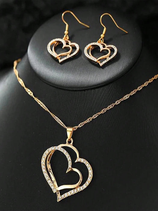 Set de joyería de 2 piezas con colgante y pendientes con forma de corazón hueco - Quierox - Tienda Online