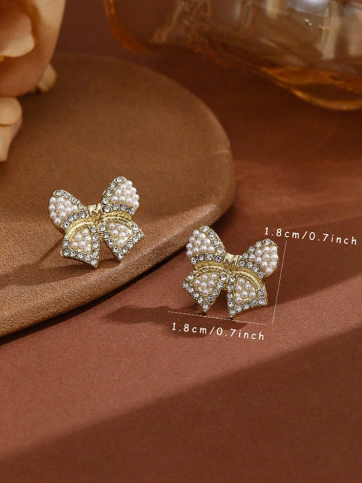Shein 1 par de pendientes de lazo de resina con perlas artificiales en color dorado - Quierox - Tienda Online