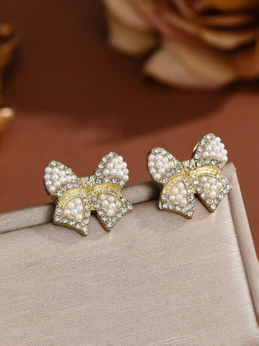 Shein 1 par de pendientes de lazo de resina con perlas artificiales en color dorado - Quierox - Tienda Online