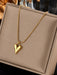Shein 1 pieza de collar con cadena estilo bambú chapada en oro y colgante de corazón de acero de titanio - Quierox - Tienda Online