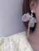 Shein 1 pieza de pendientes colgantes con decoración de lazo y perlas sintéticas - Quierox - Tienda Online