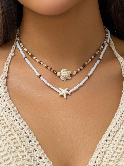SHEIN 2 piezas de collar gargantilla con colgante de estrella de mar y tortuga marina - Quierox - Tienda Online