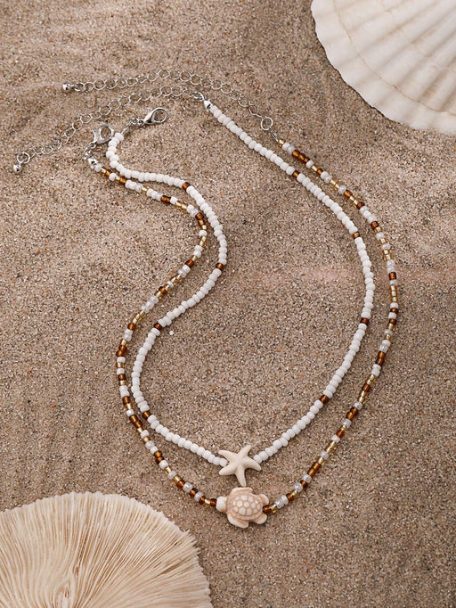 SHEIN 2 piezas de collar gargantilla con colgante de estrella de mar y tortuga marina - Quierox - Tienda Online