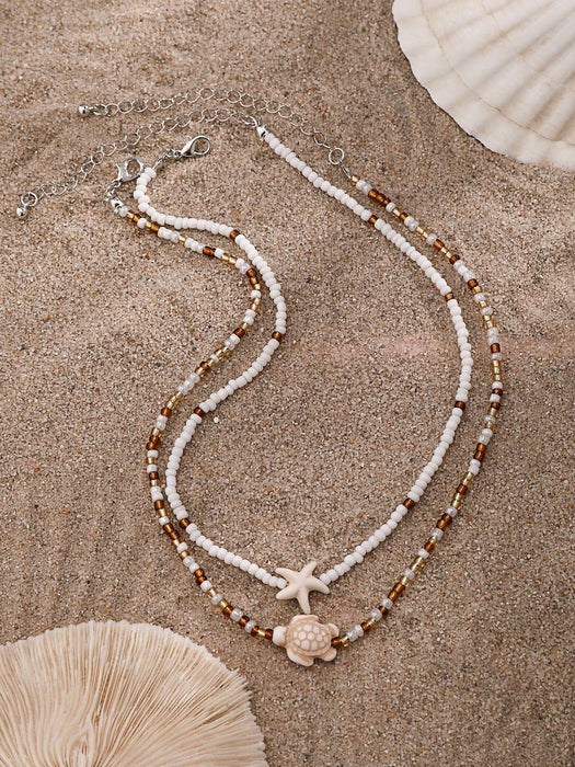 SHEIN 2 piezas de collar gargantilla con colgante de estrella de mar y tortuga marina - Quierox - Tienda Online