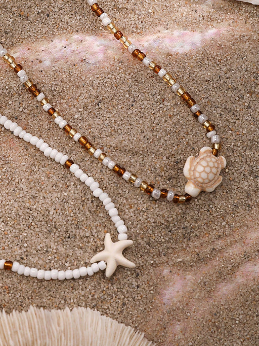 SHEIN 2 piezas de collar gargantilla con colgante de estrella de mar y tortuga marina - Quierox - Tienda Online