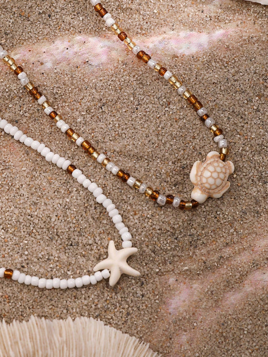 SHEIN 2 piezas de collar gargantilla con colgante de estrella de mar y tortuga marina - Quierox - Tienda Online