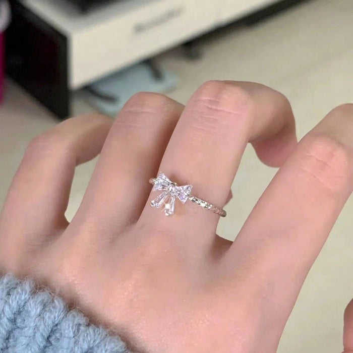 SHEIN Anillo ajustable con lazo abierto de plata "Time Princess" de JINLU - Quierox - Tienda Online