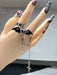 SHEIN Anillo Negro Cruzado Dulce Y Fresco, Estilo De Mina Terrestre ajustable - Quierox - Tienda Online