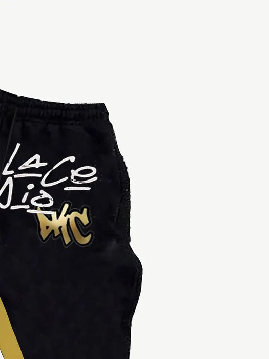 Shein Atuendo casual para hombre con un gráfico de diente de oro, compuesto por un hoodie negro combinado con pantalones acampanados - Quierox - Tienda Online