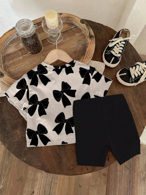 SHEIN camiseta de manga corta con cuello redondo y estampado de lazo y leggings de punto - Quierox - Tienda Online