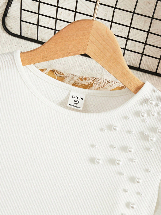 SHEIN Chica preadolescente Camiseta con cuenta de perla detalle de manga farol - Quierox - Tienda Online
